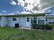 Backyard featuring a door and large window at 12541 Dearborn Dr # B, Hudson, FL 34667