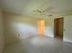 Bedroom with tile flooring, ceiling fan, and closet at 12541 Dearborn Dr # B, Hudson, FL 34667