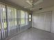 Bright Florida room features tiled floors, large window, and closet at 12541 Dearborn Dr # B, Hudson, FL 34667