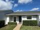 Inviting single-story home with a well-manicured lawn and symmetrical shrubbery enhancing curb appeal at 12541 Dearborn Dr # B, Hudson, FL 34667