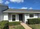 Inviting single-story home with a well-manicured lawn and symmetrical shrubbery enhancing curb appeal at 12541 Dearborn Dr # B, Hudson, FL 34667