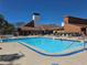 Relax and unwind by the refreshing community pool with ample seating and clear blue water at 12541 Dearborn Dr # B, Hudson, FL 34667