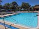 Cool off in the sparkling community pool, surrounded by lush landscaping and comfortable lounge chairs at 12541 Dearborn Dr # B, Hudson, FL 34667
