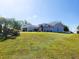 A nice home sitting on a well-manicured lot with mature landscaping at 13010 Siam Dr, Spring Hill, FL 34609