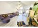 Spacious living room showcasing hardwood floors, high ceiling and double front doors at 13010 Siam Dr, Spring Hill, FL 34609