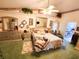 Comfortable main bedroom with a ceiling fan, plants and ensuite bathroom at 13010 Siam Dr, Spring Hill, FL 34609