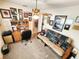 Functional home office space with a futon, desk, and lots of framed photos at 13010 Siam Dr, Spring Hill, FL 34609