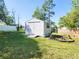 Outdoor shed with horizontal siding provides extra storage in the backyard at 13010 Siam Dr, Spring Hill, FL 34609