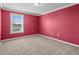 Bedroom featuring carpet floors, natural light from window, and outlets at 13366 Barkingside Pl, Spring Hill, FL 34609