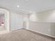 Bonus room featuring neutral carpet, base molding, and a storage closet at 13366 Barkingside Pl, Spring Hill, FL 34609