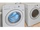 Laundry room featuring a front load washer and a dryer set at 13366 Barkingside Pl, Spring Hill, FL 34609