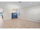 Spacious living room with tile flooring, crown molding and a window view at 13366 Barkingside Pl, Spring Hill, FL 34609