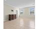 Large main bedroom offers tile floors, natural light, and ample space at 13366 Barkingside Pl, Spring Hill, FL 34609