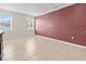 Main bedroom features neutral tones, tile floors, and large windows at 13366 Barkingside Pl, Spring Hill, FL 34609