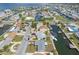 Stunning aerial view of waterfront homes, docks, and boats, offering a glimpse of the serene coastal lifestyle at 13700 Allyn Dr, Hudson, FL 34667