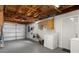Spacious unfinished basement area with laundry appliances and open access to a garage at 13700 Allyn Dr, Hudson, FL 34667