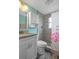 Bathroom features a granite countertop, and tiled walk-in shower at 13700 Allyn Dr, Hudson, FL 34667
