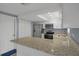 The kitchen features granite countertops and stainless-steel appliances with lots of cabinet space at 13700 Allyn Dr, Hudson, FL 34667