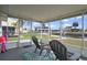 Screened lanai overlooks the canal, offering a tranquil view and a peaceful outdoor living space at 13700 Allyn Dr, Hudson, FL 34667
