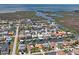 An aerial view of the homes, community waterways and backyard docks in this waterfront neighborhood with boating access at 15635 Bertram Dr, Hudson, FL 34667