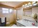 Bathroom featuring a glass shower enclosure and a vanity with a marble countertop at 15635 Bertram Dr, Hudson, FL 34667