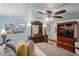 Tranquil bedroom featuring water view window, wood dresser, and ceiling fan at 15635 Bertram Dr, Hudson, FL 34667