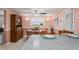 Bright, eat-in dining area featuring a breakfast bar, wood table set, and a large hutch at 15635 Bertram Dr, Hudson, FL 34667
