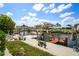 Picturesque waterfront with private boat docks, boat lifts, tables, seating and manicured landscaping at 15635 Bertram Dr, Hudson, FL 34667