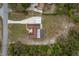 View from above of the expansive lot with a home, drive, and screened in back porch surrounded by greenery at 18216 Monteverde Dr, Spring Hill, FL 34610