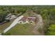 Aerial view of a home featuring screened-in patio and detached garage at 18216 Monteverde Dr, Spring Hill, FL 34610