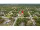 Aerial shot of a charming home surrounded by lush greenery in a tranquil neighborhood at 18216 Monteverde Dr, Spring Hill, FL 34610