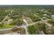 High-altitude aerial view of a property with a pool and detached garage at 18216 Monteverde Dr, Spring Hill, FL 34610