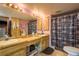 Functional bathroom with dual sinks, ample counter space, and a shower with patterned curtain at 18216 Monteverde Dr, Spring Hill, FL 34610