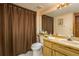 Cozy bathroom with a shower and a light wood vanity with a pink sink and ample counter space at 18216 Monteverde Dr, Spring Hill, FL 34610