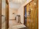 The home's front entryway shows a wood door, tile floor transitions to carpet, and hall access at 18216 Monteverde Dr, Spring Hill, FL 34610