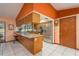 Open kitchen with granite countertops, stainless steel appliances, and bar seating at 18216 Monteverde Dr, Spring Hill, FL 34610