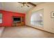 Open room with large window, wall-mounted television, carpeted flooring and a ceiling fan at 18216 Monteverde Dr, Spring Hill, FL 34610
