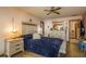 Comfortable main bedroom with a ceiling fan, wood flooring, and access to an ensuite bathroom at 18216 Monteverde Dr, Spring Hill, FL 34610