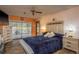 Tranquil main bedroom with sliding glass doors to the backyard and soft, natural light at 18216 Monteverde Dr, Spring Hill, FL 34610