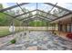 A stunning covered patio features a tile floor, perfect for outdoor living and enjoying the view at 18216 Monteverde Dr, Spring Hill, FL 34610