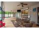 Enjoy outdoor living on this patio with outdoor seating, a ceiling fan, and views of the backyard at 18216 Monteverde Dr, Spring Hill, FL 34610