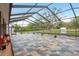 A stunning covered patio features a tile floor, perfect for outdoor living and enjoying the view at 18216 Monteverde Dr, Spring Hill, FL 34610