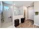 Bathroom featuring glass enclosed walk-in shower and wood look tile flooring at 19879 Tattnall Way, Brooksville, FL 34601