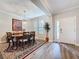 Formal dining area with a hardwood floor, a large table, and plenty of natural light at 19879 Tattnall Way, Brooksville, FL 34601