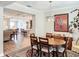 Cozy dining room with an oval table, chandelier, and views of the entryway at 19879 Tattnall Way, Brooksville, FL 34601