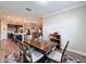 Dining room features a wood table with gray chairs and a patterned rug at 19879 Tattnall Way, Brooksville, FL 34601