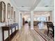 Spacious foyer with hardwood floors, mirrors, and an open view into the living areas of the home at 19879 Tattnall Way, Brooksville, FL 34601