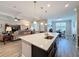 Open kitchen area features a large island with seating that flows seamlessly into the living room at 19879 Tattnall Way, Brooksville, FL 34601