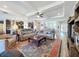 Inviting living room with a ceiling fan, recessed lighting, and views into the kitchen at 19879 Tattnall Way, Brooksville, FL 34601