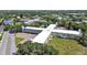 Community aerial view showcasing lush landscaping and proximity to nearby community amenities at 2221 Swedish Dr # 15, Clearwater, FL 33763
